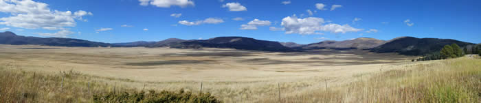 1010151512_Pano Grassland in the mountains with bright blue sky